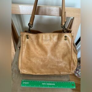 Leather spacious hand bag, ideal for traveling.